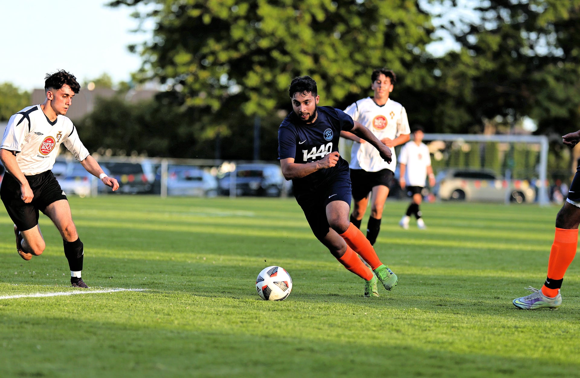 Soccer players playing at the Nations Cup tournament.