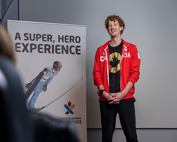 Olympian Evan Dunfee giving a presentation